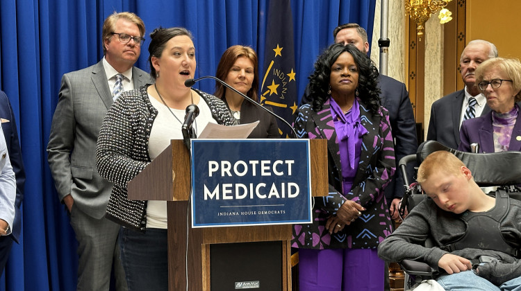 Jennifer Dewitt speaks at a Feb. 13 rally alongside House Democrats, calling for protections for families like hers to remain in the attendant care program. - Abigail Ruhman / IPB News