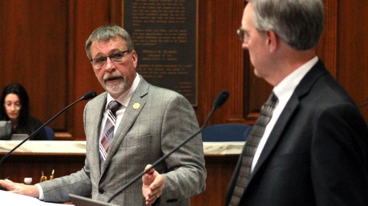 Rep. Jim Pressel (R-Rolling Prairie), left, addresses Rep. Matt Pierce (D-Bloomington), right, during a House floor debate on a highway work zone speed cameras bill on Monday, Feb. 6, 2023.  - Brandon Smith/IPB News