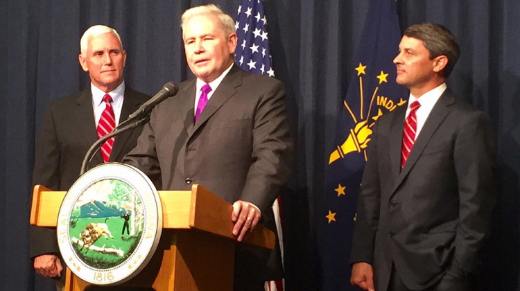 Jim Schellinger, center, was named the head of the Indiana Economic Development Corporation in 2015 by then-Gov. Mike Pence, left.  - Brandon Smith/IPB News