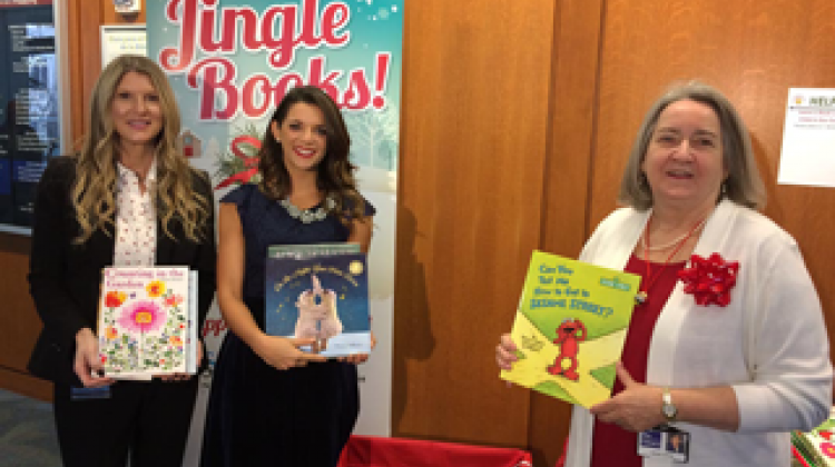 During a launch event on November 26 at Central Library, Indianapolis First Lady Stephanie Hogsett, Sondhi Solutions representative Lindsay Szostak, and IndyPL CEO Jackie Nytes donated the first books of the campaign into the "Jingle Books" receiving box, helping to ensure that every child receives a book as a gift during the holiday.