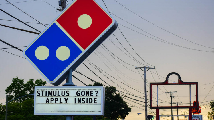 A Domino's Pizza in South Bend tells workers to apply if they're run out of pandemic stimulus money.  - Justin Hicks/IPB News