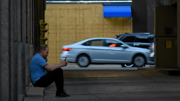 A worker in downtown Indianapolis takes a smoke break. - Justin Hicks/IPB News