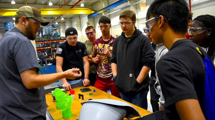 Jeremey Rorie shows Penn High School students what he does for work at B&B Molders in Mishawaka. - Justin Hicks/IPB News