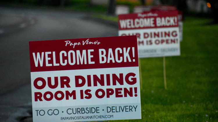 Papa Vino's, a restaurant in Mishawaka, advertises that its dining room has reopened after closing due to the state's orders.  - (Justin Hicks/IPB News)