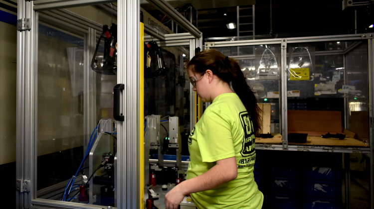 A worker at a factory in North Vernon, Indiana, works with a plastics manufacturing robot. A recent study released by the Brookings Institution shows 42 percent of Hoosiers are in a "good job." - Justin Hicks/IPB News