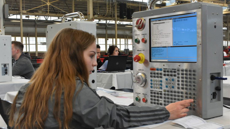 A Dozen Schools Selected To Pilot Indiana's New CTE CurriculumA career and technical education student in Indiana programs a machine at a statewide SkillsUSA competition.  - Justin Hicks/IPB News