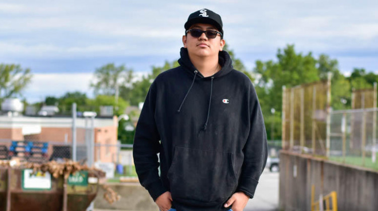 Ramiro Delgado poses for a portrait behind the loading bay where he reports for his apprenticeship with the building maintenance team at Indianapolis Public Schools.  - Justin Hicks/IPB News