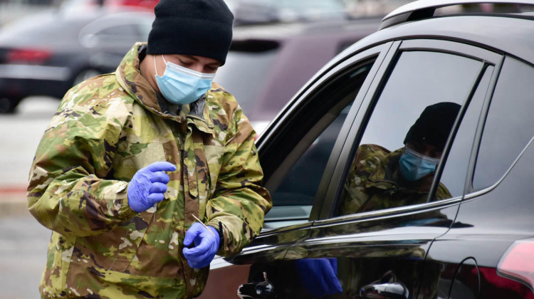 A National Guard member helps at a drive thru vaccination clinic in South Bend. - (Justin Hicks/IPB News)