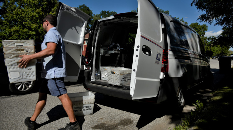 A postal worker in South Bend delivering mail.  - Justin Hicks/IPB News