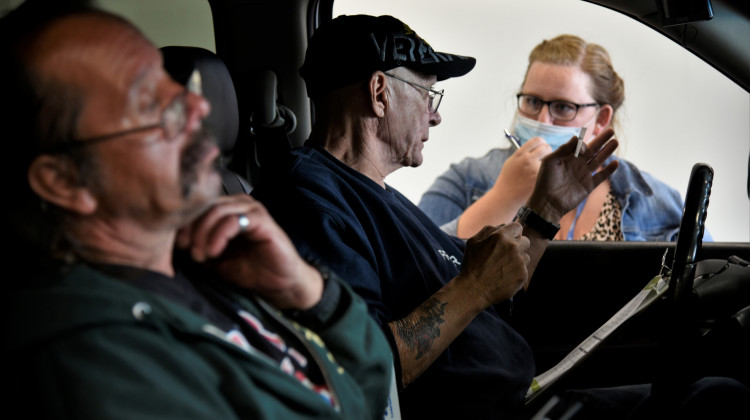 Workers get information about job openings at a drive-thru employment fair in Elkhart during the pandemic. - Justin Hicks/IPB News