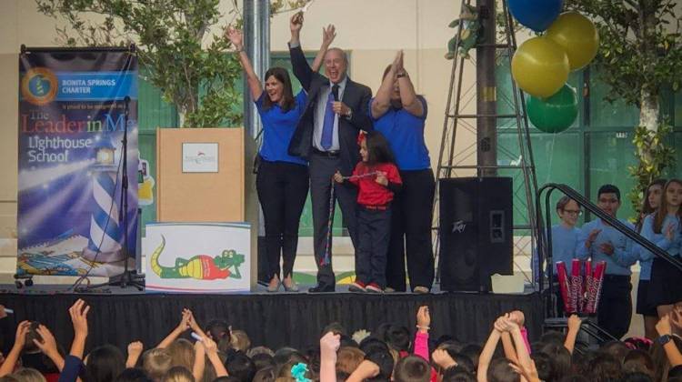 Charter Schools USA CEO Jonathan Hage, center, celebrates an academic recognition for Bonita Springs Charter School in Bonita Springs, Fla. in February 2017. - Charter Schools USA