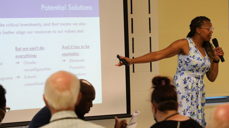 Indianapolis Public Schools Superintendent Aleesia Johnson explains a five-point proposal to reorganize the district's schools and academic offerings during a public meeting Thursday, June 23, 2002 at William Penn School 49. - (Eric Weddle/WFYI)