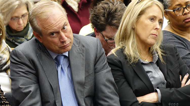 Jon Hage, CEO of Charter Schools USA, and Sherry Hage, CEO of Noble Education Initiative, listen to members of the Indiana Charter School Board at a meeting Friday, Dec. 13, 2019. - Eric Weddle/WFYI News