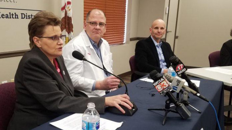 Champaign County Public Health Ditrict Administrator Julie Pryde (left) speaks at a news conference March 15 announcing the county's first confirmed COVID-19 case. - Jim Meadows/Illinois Newsroom