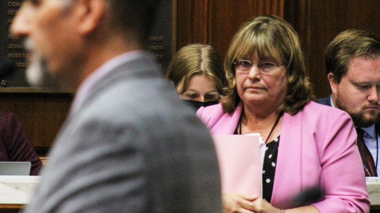 Rep. Karen Engleman (R-Georgetown) stands on the House floor on Aug. 4, 2022. She watches a fellow lawmaker speaker about her proposed amendment to the abortion ban bill that would force rape and incest victims to give birth. - Brandon Smith/IPB News