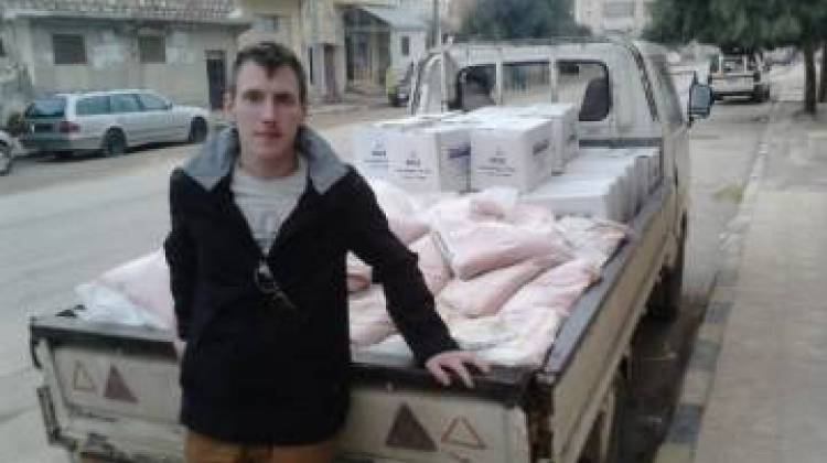 Kassig with a truck loaded with supplies, date unknown. - Photo provided by the Kassig family.