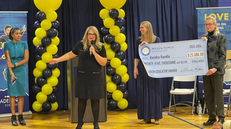 Indiana Secretary of Education Katie Jenner presents the award to Kendra Randle. - Sydney Dauphinais/WFYI