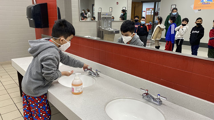 A student washes their hands at Sunnyside Elementary School in the Lawrence Township Schools district on Friday, Jan. 7, 2022. - (Elizabeth Gabriel/WFYI)