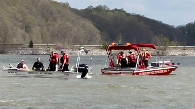 Rescue crews search the water of Monroe Lake for the two missing students Saturday. - Liz DeSantis/WFIU