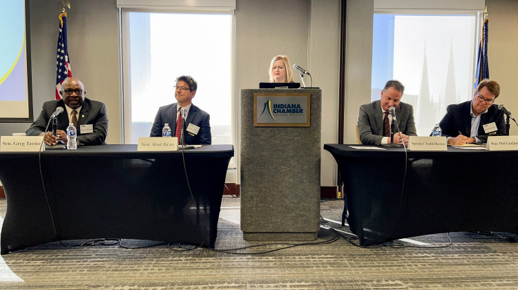 The four legislative caucus leaders discuss the 2023 session at an Indiana Chamber of Commerce event on Nov. 21, 2022. From left to right, the leaders are Sen. Greg Taylor (D-Indianapolis), Senate President Pro Tem Rodric Bray (R-Martinsville), Speaker Todd Huston (R-Fishers) and Rep. Phil GiaQuinta (D-Fort Wayne). - Brandon Smith/IPB News