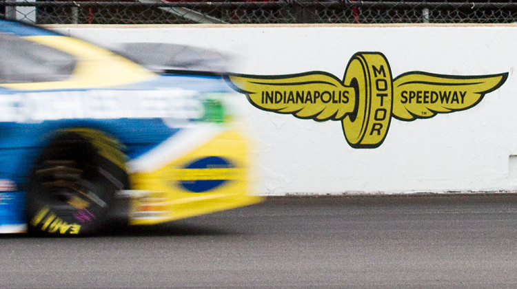 A car streaks past the Indianapolis Motor Speedway during the Brickyard 400 on Sunday, Sept. 8, 2019. - Doug Jaggers/WFYI