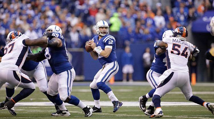 Colts quarterback Andrew Luck (12) looks to throw during the first half of an NFL football game against the Denver Broncos, Sunday. - AP Photo/AJ Mast