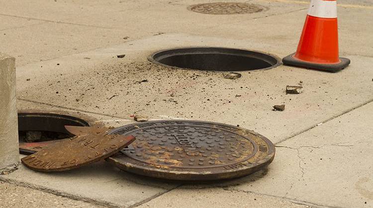 The underground explosion left debris on the sidewalk at the northwest corner of Capitol Avenue and North Street. - Doug Jaggers