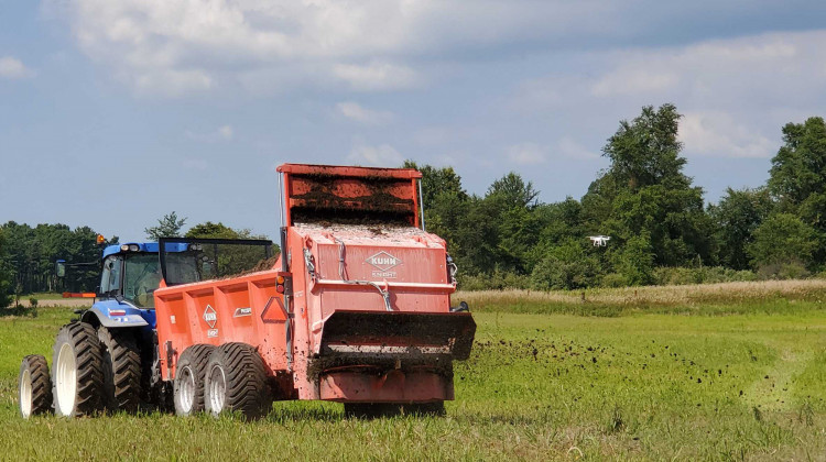 Companies demonstrate their solid manure spreaders out in the field to expo attendees. - Samantha Horton/IPB News