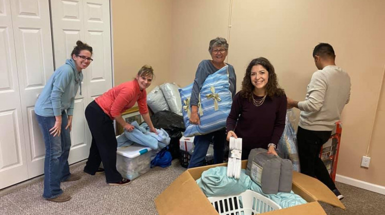 Community members set up an apartment with donated items for an Afghan family. - (Photo: Emily Wornell on Facebook)