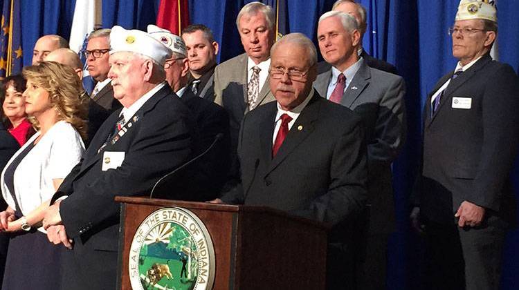 Retired Maj. Gen. Martin Umbarger, former head of the Indiana National Guard, inroduces Gov. Mike Pence during a bill signing ceremony Tuesday. - Brandon Smith