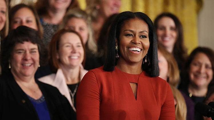 Then first lady Michelle Obama laughs as she speaks at the 2017 School Counselor of the Year ceremony in the East Room of the White House. - AP Photo/Manuel Balce Ceneta