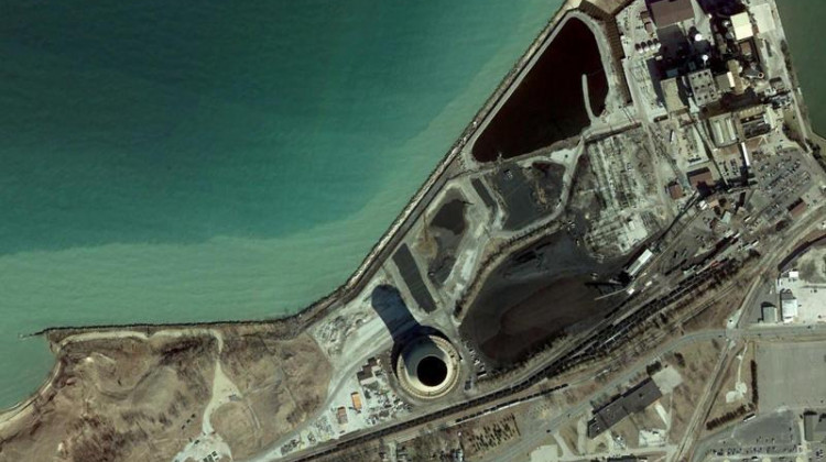 An aerial view of NIPSCO's Michigan City coal plant. A series of steel walls run along the shoreline in front of the plant to protect it.  - Courtesy of NIPSCO