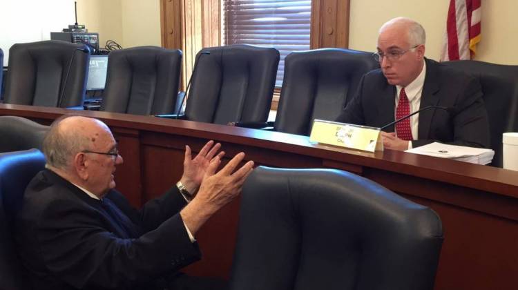 Sen. Frank Mrvan, D-Hammond, left, speaks to Sen. Mike Delph, R-Carmel, after the final meeting of the Senate study committee on immigration. - Brandon Smith/IPBS