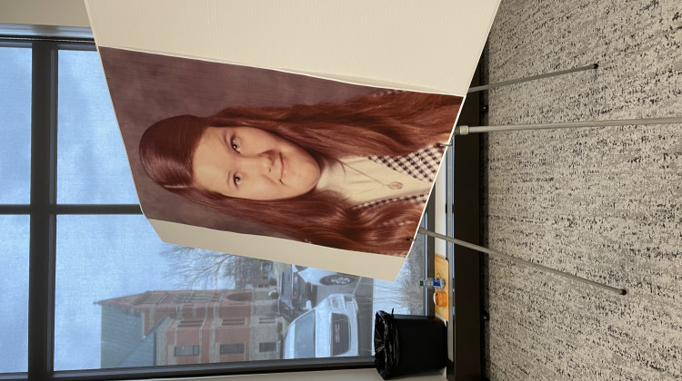 Laurel Mitchell's school photo stood next to investigators Tuesday at a press conference announcing the arrest of two men in connection to her death in 1975. - Rebecca Green / WBOI News