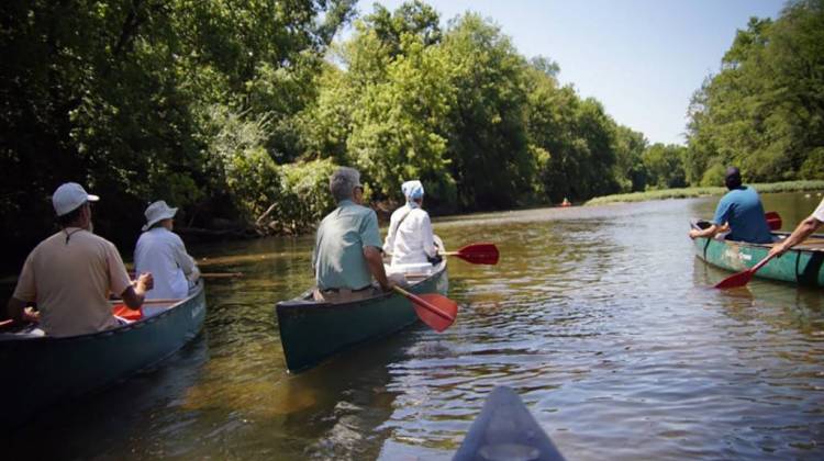 A group canoes down the White River. - Hoosier Environmental Council