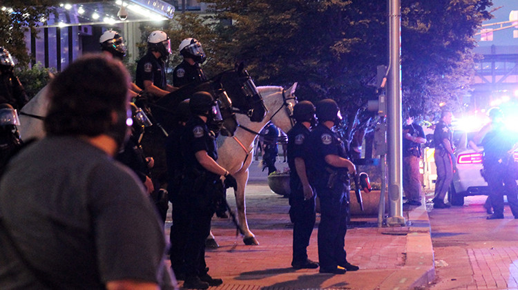 Mounted police gather a block away from the initial clash with protesters. The crowd gathered at Delaware and Market streets on Saturday, May 30. - Lauren Chapman/IPB News