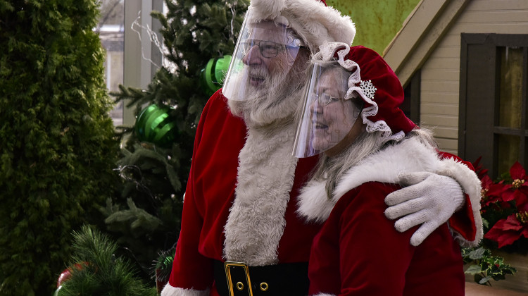 Mr. and Mrs. Santa Claus pose for an image while at a mall in December 2020. Dr. Scott Stienecker said he expects the holidays to become a “pretty active COVID season,” based on how these variants have behaved in other countries. - Justin Hicks