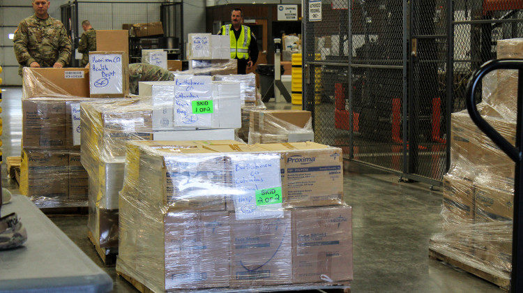 Members of the Indiana National Guard load and sort supplies from the Strategic National Stockpile to deliver to hospitals across the state. - Lauren Chapman/IPB News