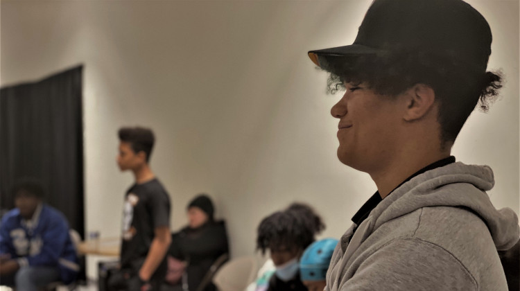 Cam, 15, stands in a circle for a meeting of New B.O.Y. on the city's far east side on Wednesday, Oct. 19, 2022. Cam started attending the group last year as part of a probation requirement. - Dylan Peers McCoy/WFYI