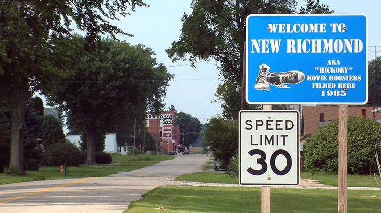 A sign on the road into New Richmond, Indiana boasts the town's role in the 1985 film "Hoosiers." The town is one of three where Tipmont REMC will roll out high-speed internet services. - Huw Williams/CC-0