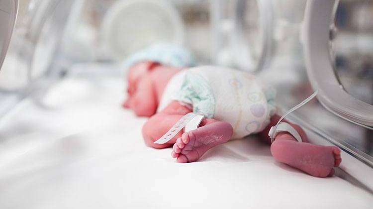 Preliminary findings of an Indiana State Department of Health study highlight a link between the stateâ€™s high infant mortality rate and the drug epidemic. - stock photo