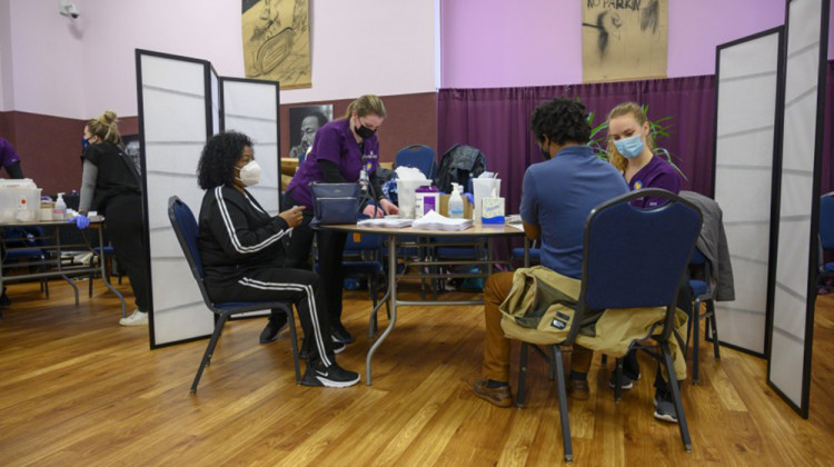 Several people get the COVID-19 vaccine at a mass clinic at the Corinthian Baptist Church in Des Moines. The church was intentionally selected for the clinic as a safe space for many members of the Black community to get vaccinated. - Natalie Krebs/Side Effects Public Media