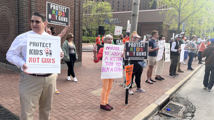 Demonstrators gathered outside National Rifle Association’s annual convention on Saturday, April 15, 2023 to read names of the roughly 1,600 children killed by guns last year. - Lee V. Gaines / WFYI