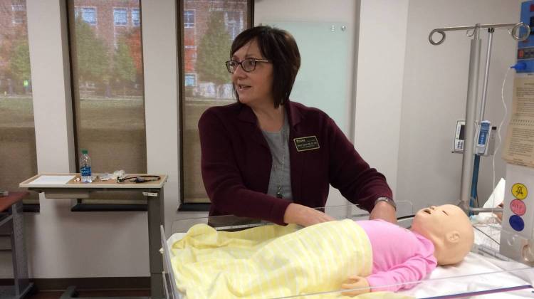 Professor Deborah Spoerner demonstrates a model in the Purdue Nursing School's new simulation lab. - Sarah Fentem/WBAA