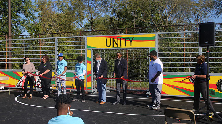 Mayor Joe Hogsett cuts the ribbon alongside Ray Gaddis and students from KIPP Indy College Prep Middle School. The celebration was for the grand opening of a new mini-pitch at Oscar Charleston Park. - Indy Parks