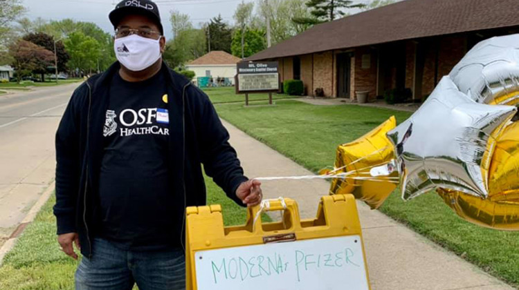 Keith Thomas is pastor at Mt. Olive Missionary Baptist Church in Champaign, Illinois, and a hospital chaplain with OSF HealthCare. He poses for a photo during a vaccine clinic hosted at his church on May 15, 2021. - Amanda Gray / Mt. Olive Missionary Baptist Church