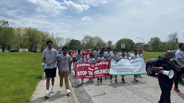 Young people marched in Indianapolis to call for an end to violence. Organizers also gave out gun lock boxes. - Sydney Dauphinais/WFYI