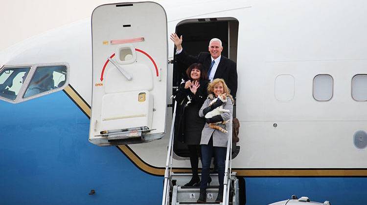 Vice President-elect Mike Pence boards the plane with his wife Karen, his daughter Charlotte and family cats Oreo and Pickle. - Shelby Mullis - The StatehouseFile.com
