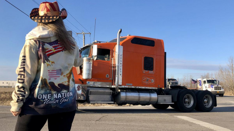 Idaho resident Kim West greets convoy drivers as they arrive in Monrovia. West said she had been traveling with the group since it left southern California last week. - (Mitch Legan, WTIU/WFIU News)