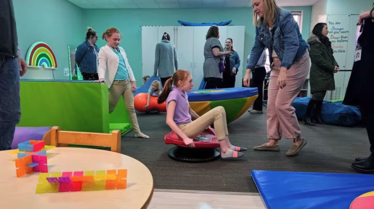 Students and staff explore the new sensory room inside Burkhart Elementary in Perry Township. - Aleksandra Appleton/Chalkbeat